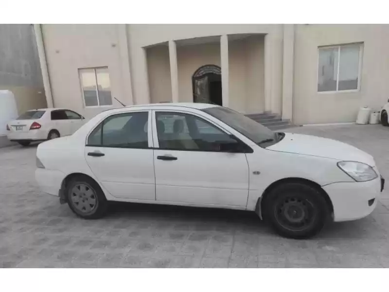 مستعملة Mitsubishi Lancer للبيع في الدوحة #11346 - 1  صورة 